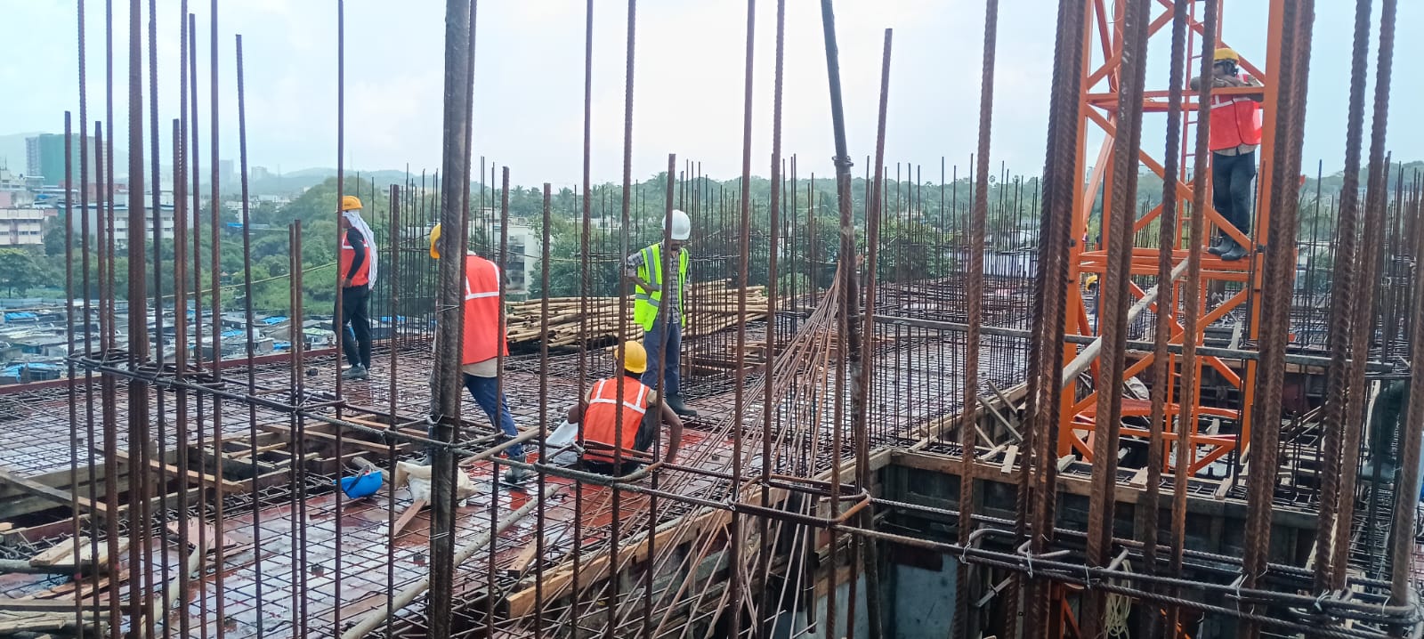 Gativan crew tying reinforcement steel on a high-rise slab
