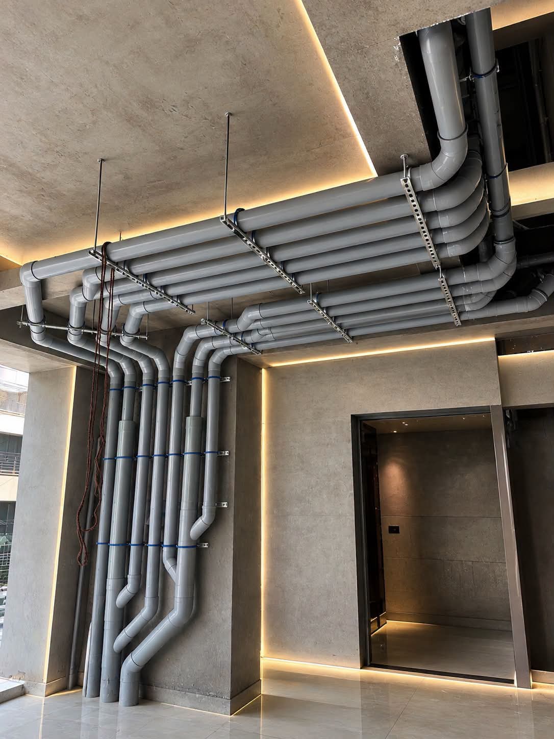 Ceiling pipe runs installed by Gativan in a residential tower