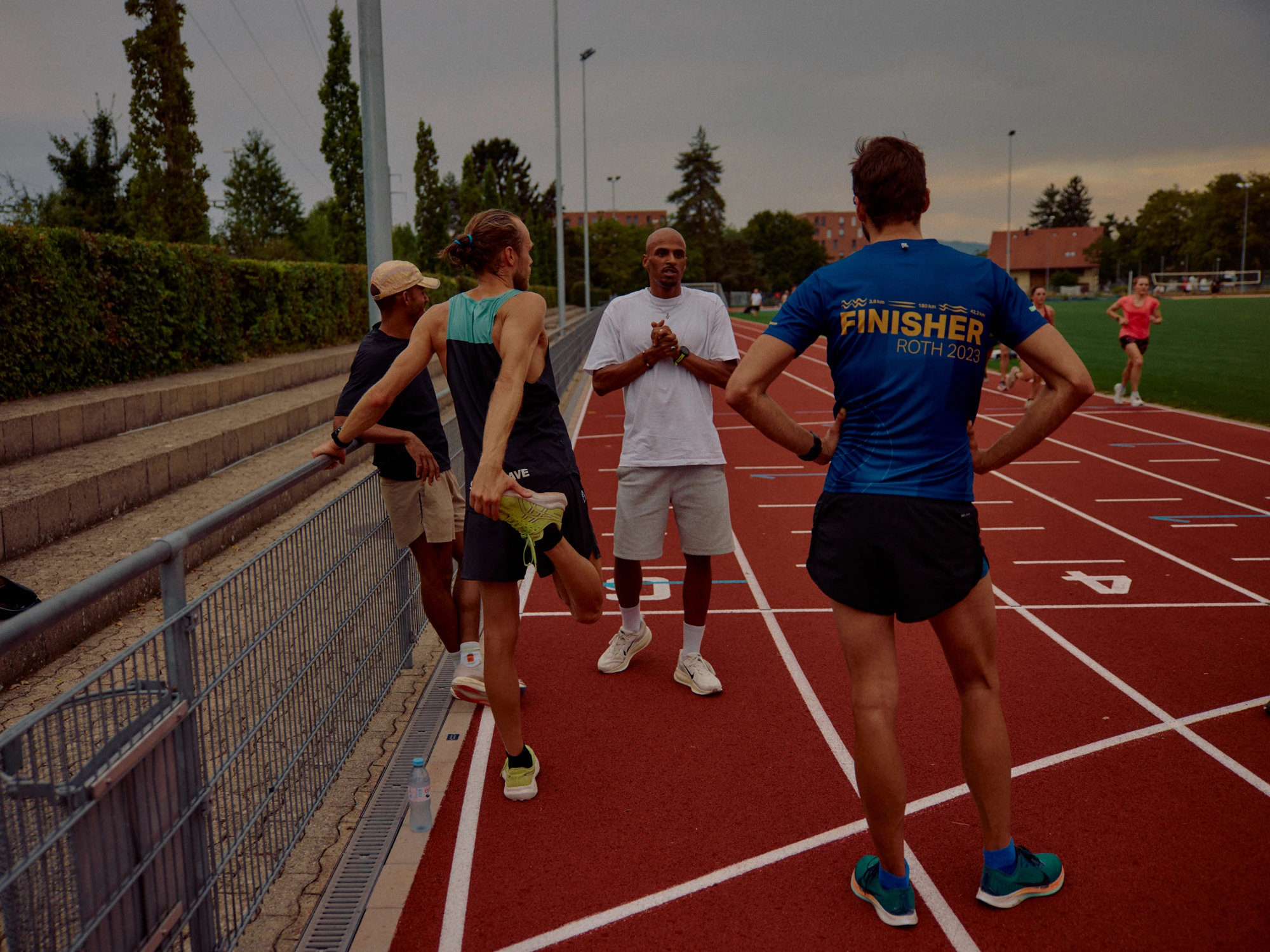Coach talking to athletes
