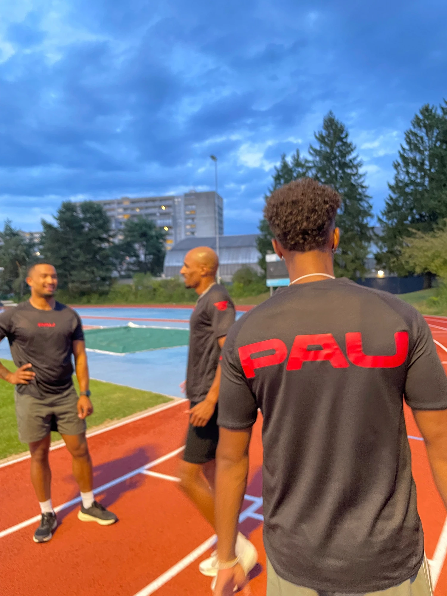 Athletes in PAU shirts at track