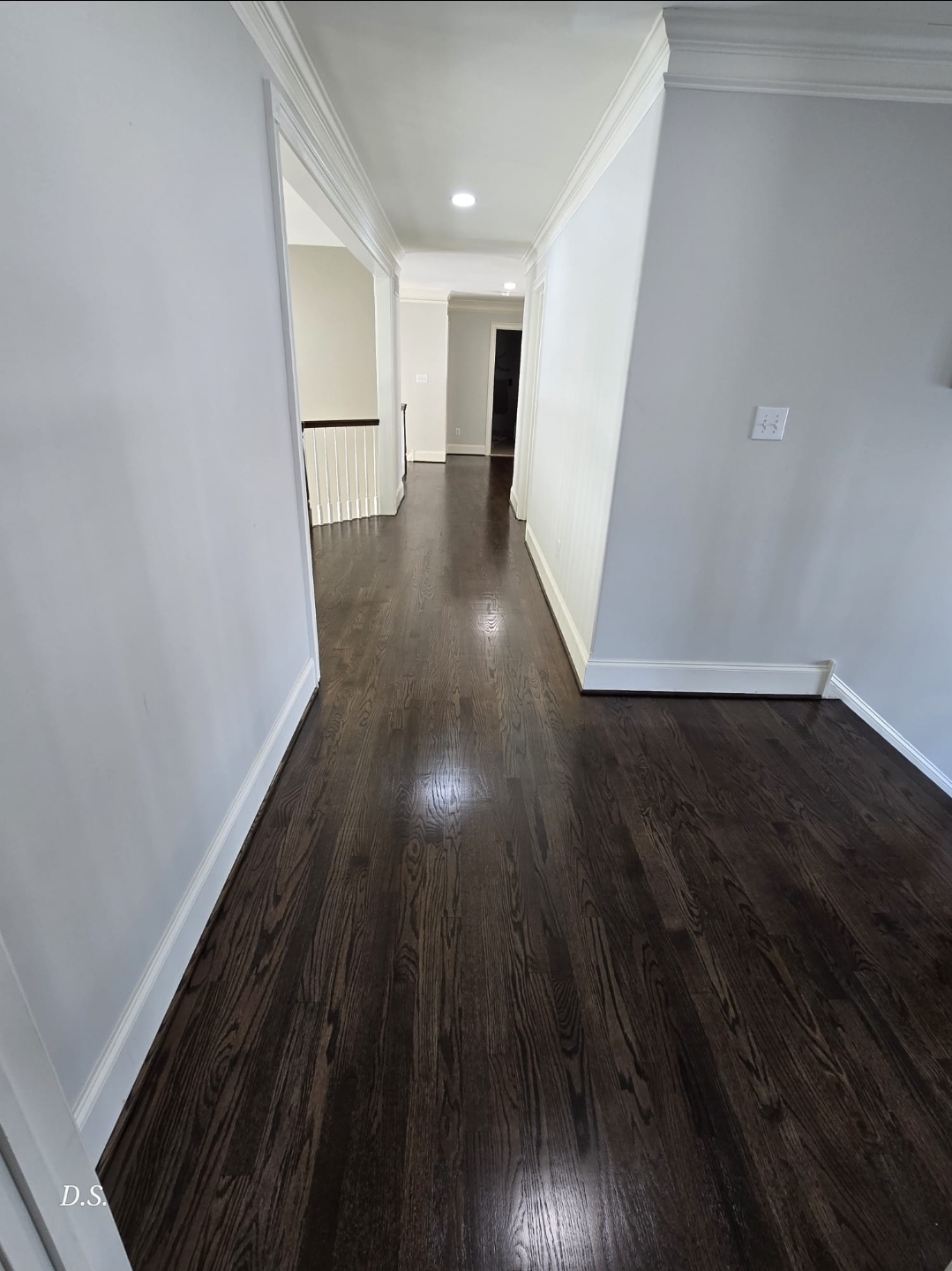 Completed dark stained hardwood floor at a Pennsylvania entryway