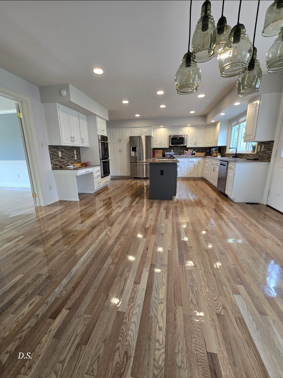 Completed hardwood floor in a bright Pennsylvania kitchen