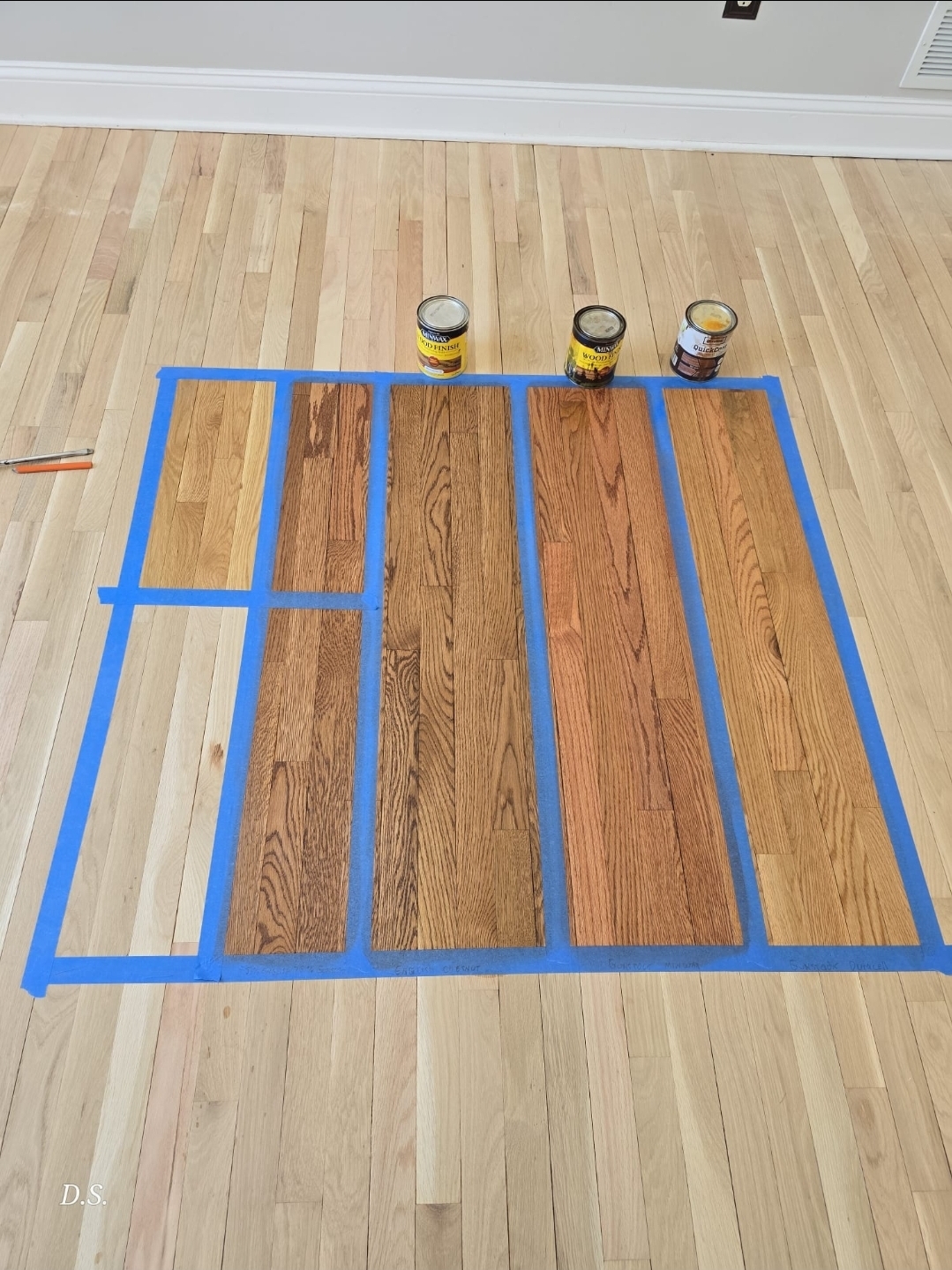 Hardwood finish samples arranged on a Pennsylvania floor