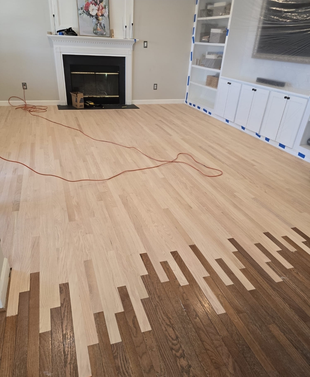 Hardwood floor repair in progress in a Pennsylvania room