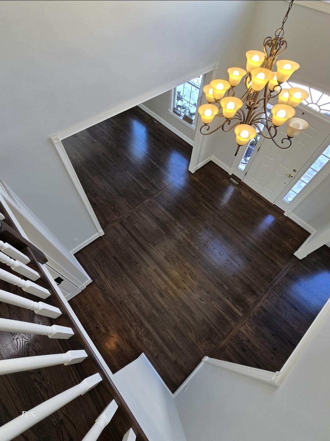 Completed dark stained hardwood floor in a Pennsylvania hallway