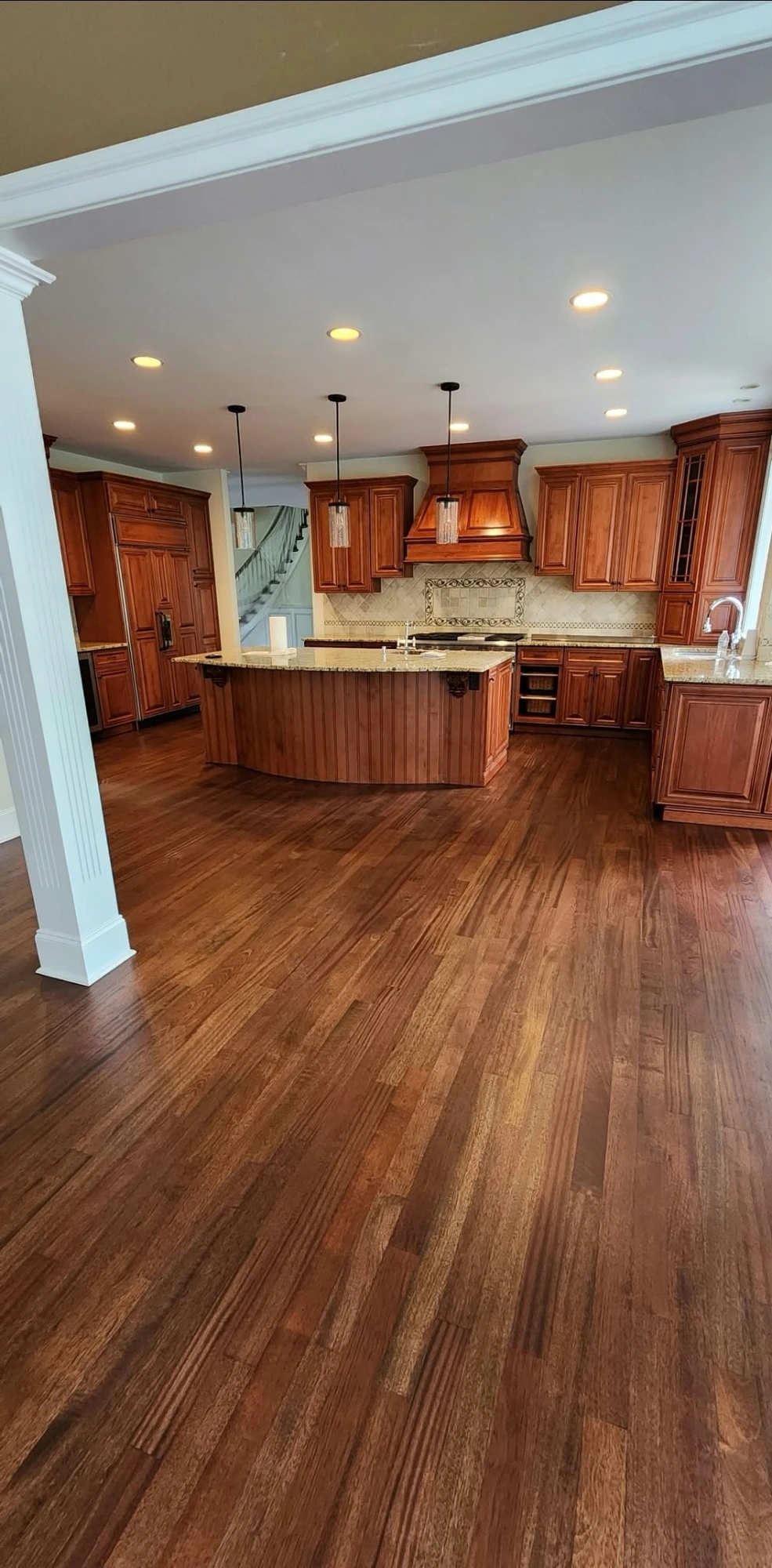Completed dark stained hardwood floor in a Pennsylvania hallway