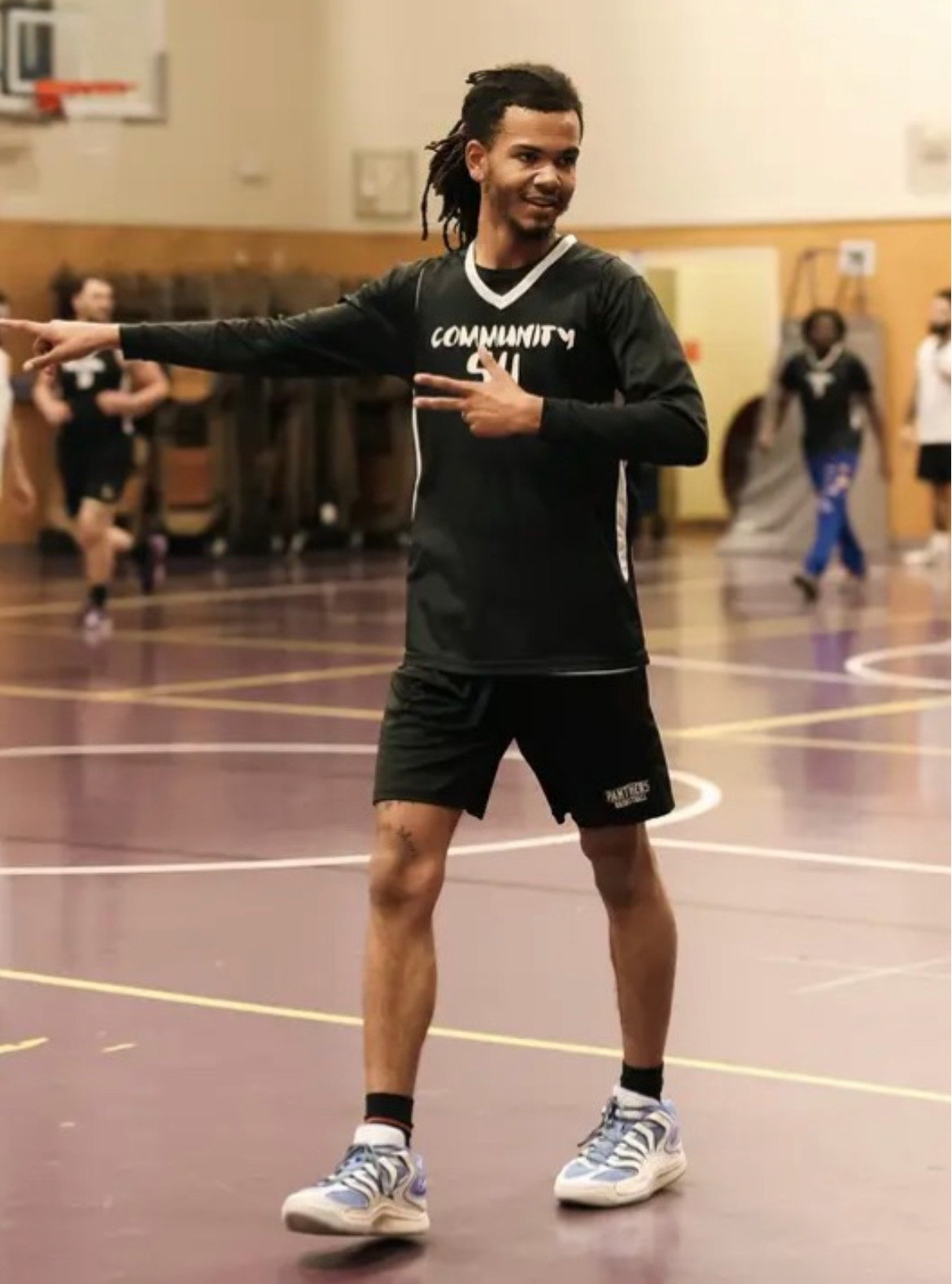 Theo running a training session on court