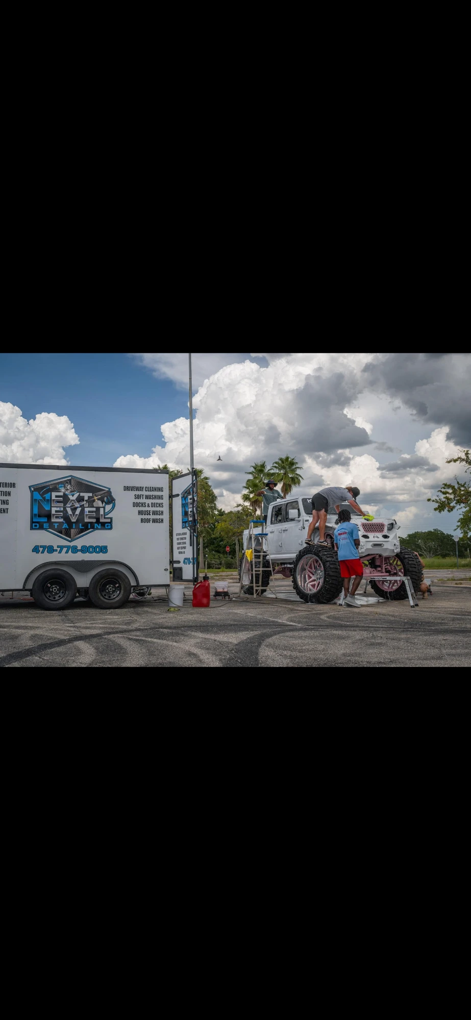 Next Level Detailing mobile trailer on-site