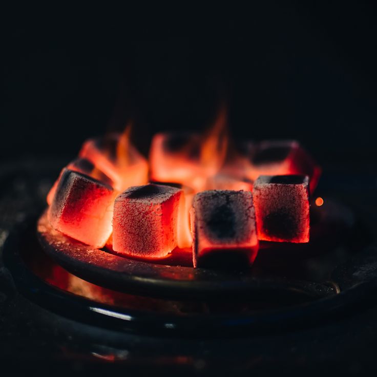 Coconut charcoal cubes glowing during burning